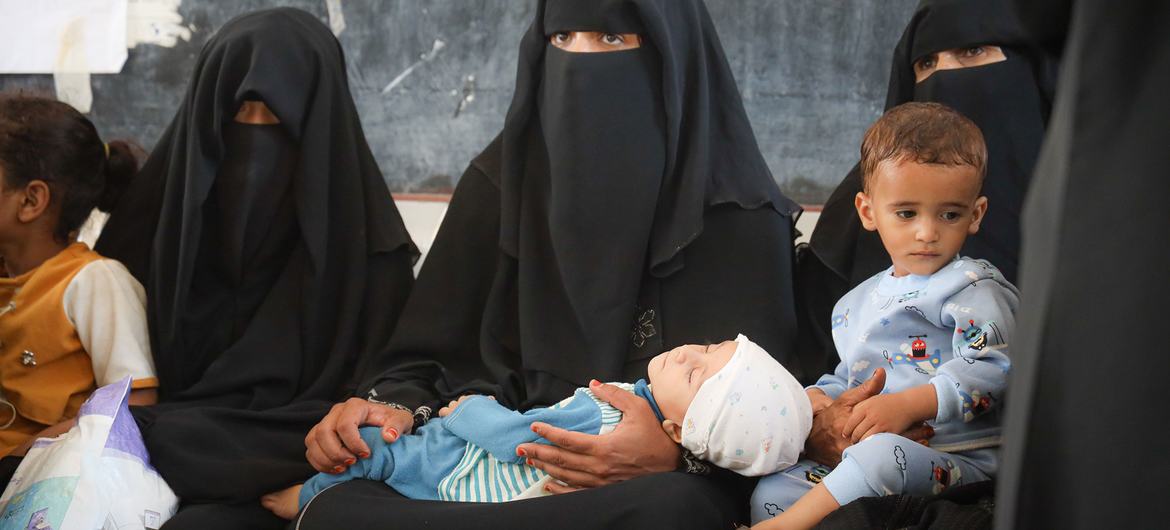 Mothers bring their children to a clinic for malnutrition prevention treatment in Taiz, Yemen, that is supported by the World Food Programme (WFP).