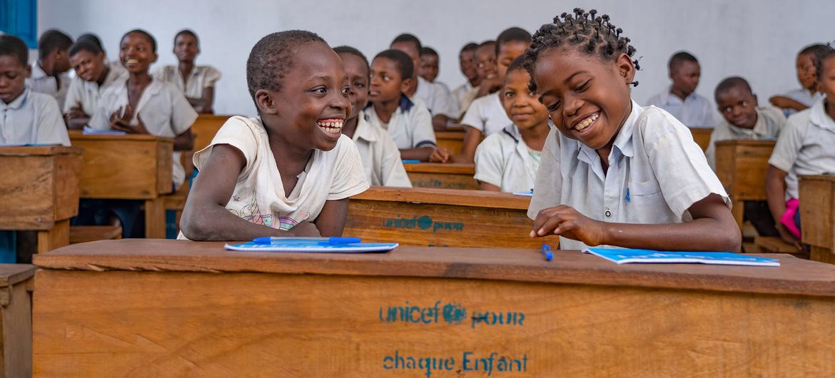 Fourth-grade students attend class at their new school, which was rebuilt after it was destroyed by fighting in the Kasai-Oriental province of DR Congo.