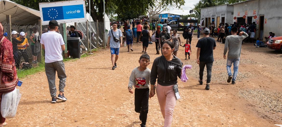 People walk the streets of Lajas Blancas in Panama, a migrant reception centre close to the border with Colombia.