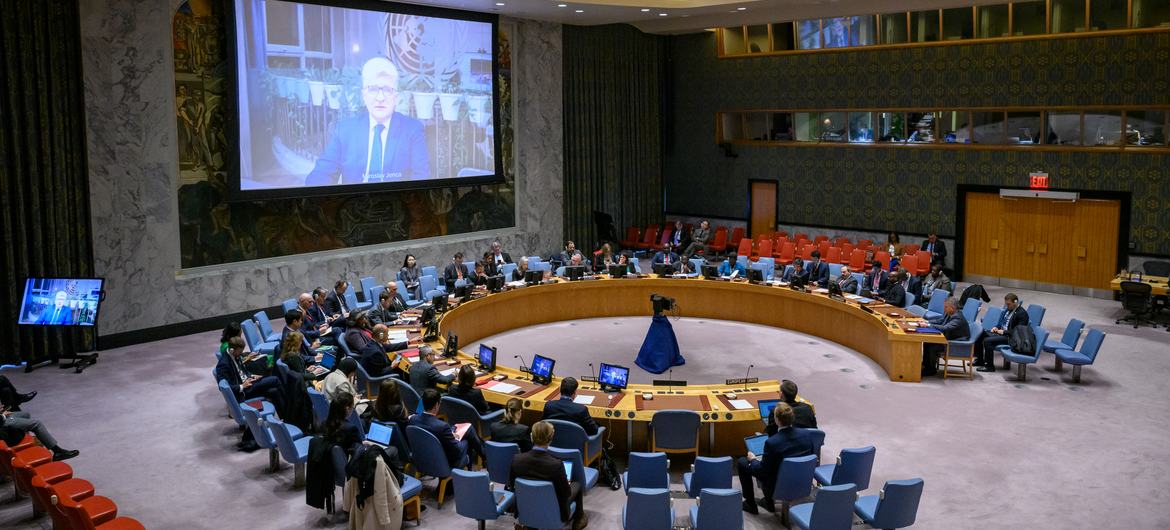 Miroslav Jenča (on screens) briefing the Security Council.