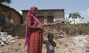 A woman in Udaipur, India, heads to a clinic with her son for an antenatal check-up. (file)