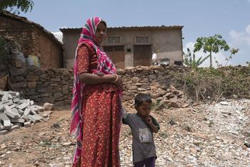 A woman in Udaipur, India, heads to a clinic with her son for an antenatal check-up. (file)