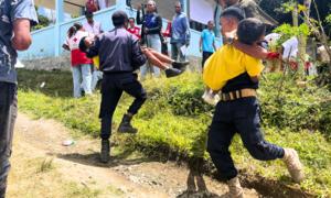 Residents of Orlalan village, in Timor-Leste, engage in rescue and evacuation drills
