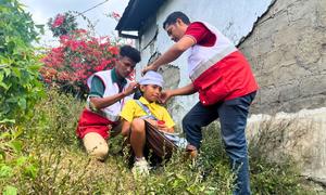 Volunteers of the Timor-Leste Red Cross train firs aid procedures during evacuation drill