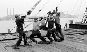 Steel workers hoist a girder in place in the meeting hall area of the UN Headquarters where construction was completed in June 1951.
