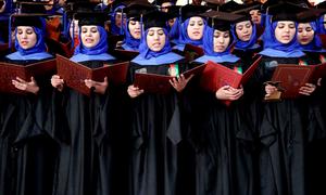 Afghan students perform during graduation at their degree-award ceremony at a university in Herat, Afghanistan. 