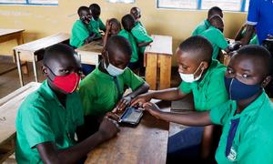 Children masked to protect them from COVID-19 infection, studying at a school in Kayonza District in Eastern Rwanda.