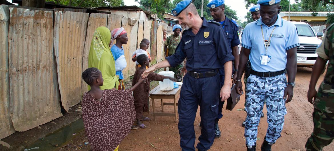 MINUSCA police officers interact with community members.