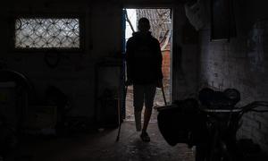 A 16-year-old boy, who lost his right leg in a landmine explosion and can no longer walks, stands on crutches at his house in Kharkiv, Ukraine. (file)