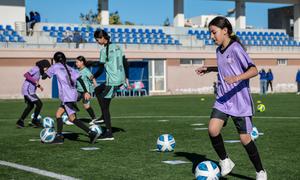 Girls play football at the "Her Game" festival, organized by Generation Amazing in Morocco.