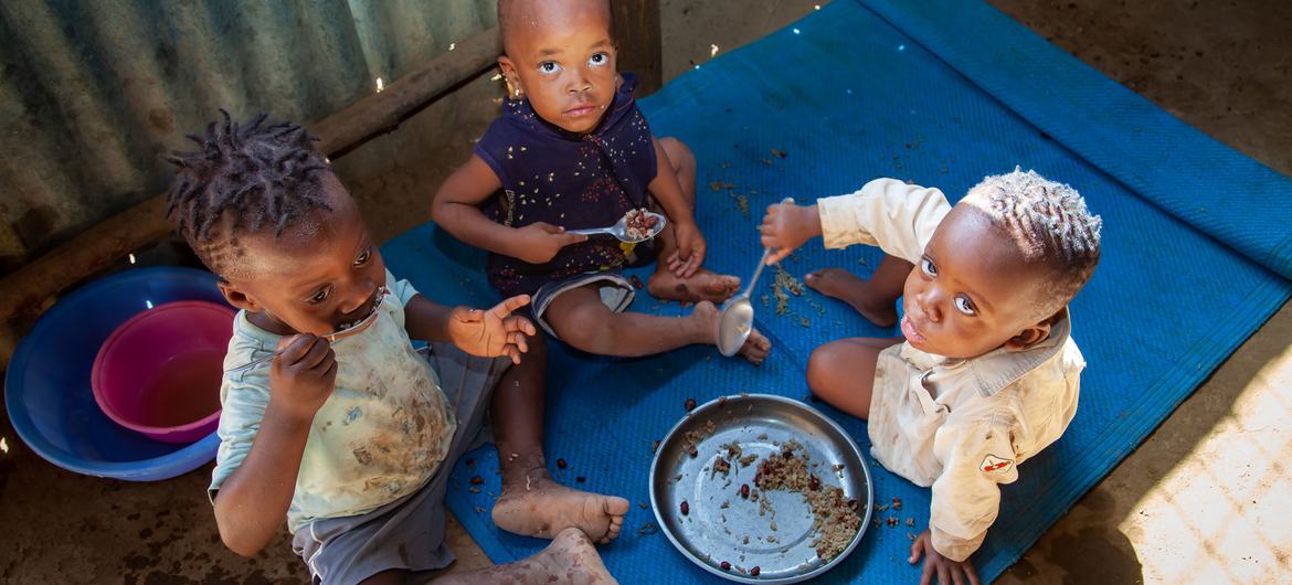 Three children eat a meal at home in Kakuma refugee camp in Kenya. (file)