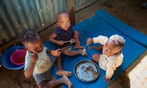 Three children eat a meal at home in Kakuma refugee camp in Kenya. (file)