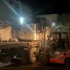 Trucks carrying bags of flour arrive at Al-Banna Bakeries in Deir al-Balah, central Gaza Strip, at dawn on Friday.