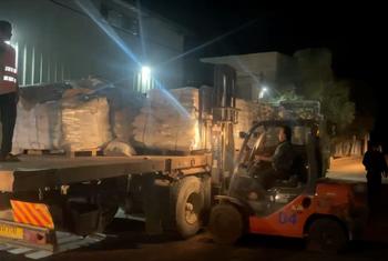 Trucks carrying bags of flour arrive at Al-Banna Bakeries in Deir al-Balah, central Gaza Strip, at dawn on Friday.