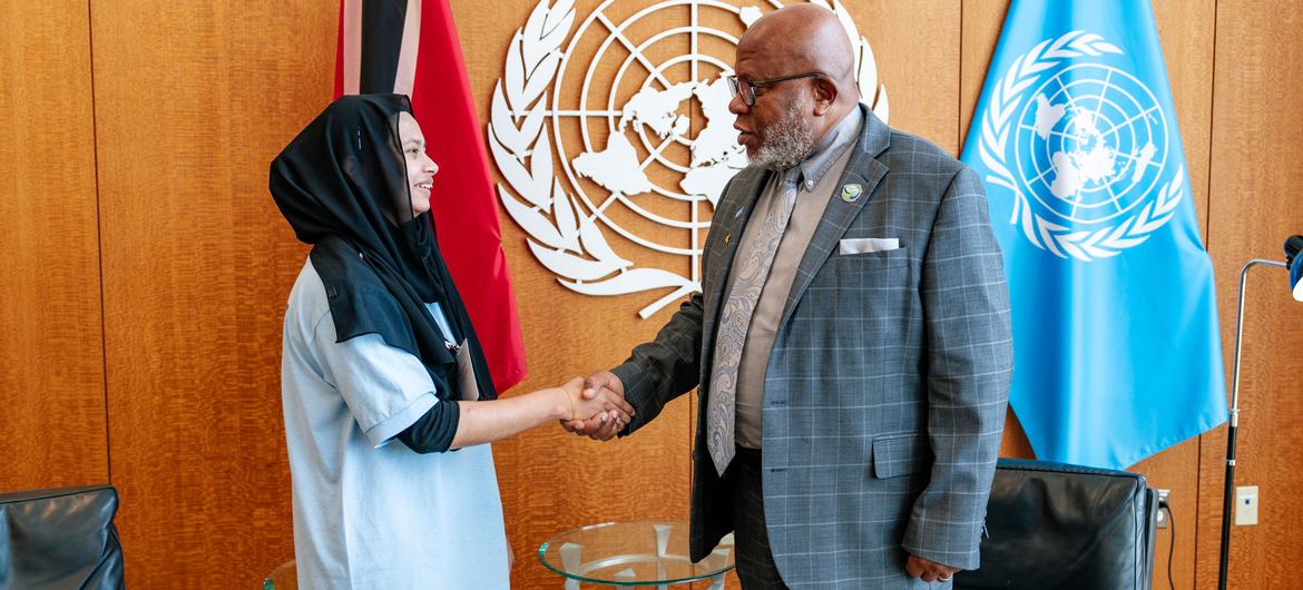 General Assembly President Dennis Francis (right) meets  New York City school student Fariha Akter.