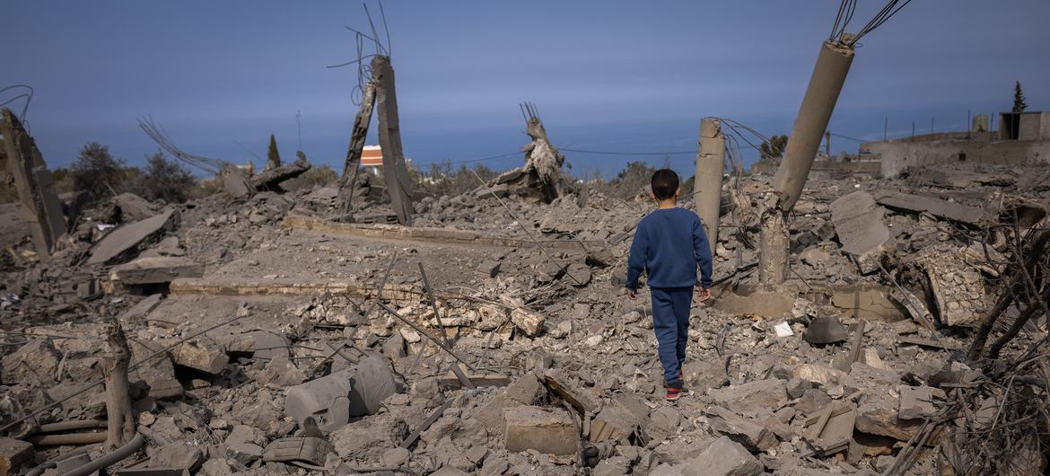 A 5-year-old boy walks through destroyed buildings in Majdal Zoun, southern Lebanon. (file)