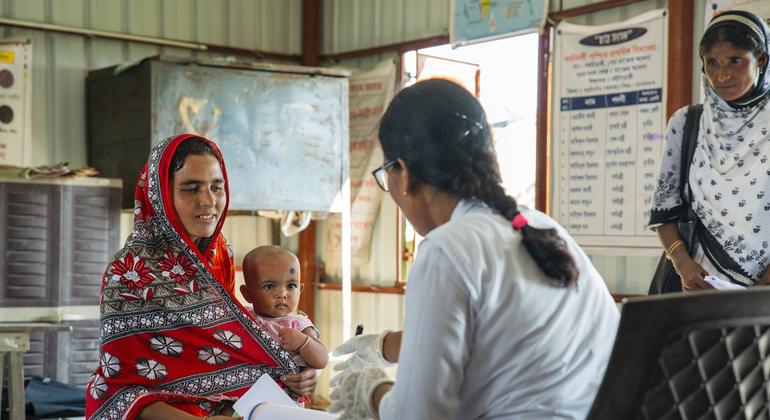 Assistant nurse Nirupama Roy is vaccinating nine-month-old Noor, who came with her mother Munawara Khatun. Assistant nurse Nirupama Roy is vaccinating nine-month-old Noor, who came with her mother Munawara Khatun.