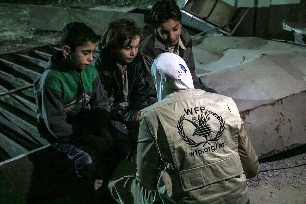 WFP Staff speaks with children in Eastern Ghouta, Syria, where cases of severe malnutrition and mortality have been reported and some households having resorted to rotating meals amongst family members.