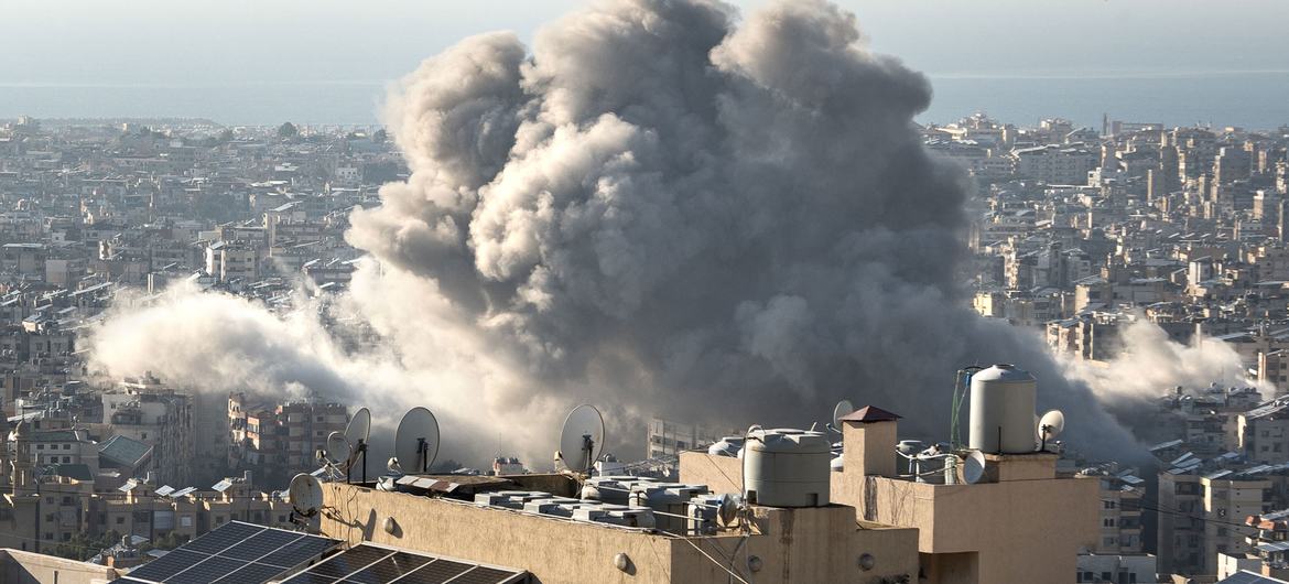 A plume of smoke caused by the impact of a missile strike is visible over the Haret Hreik neighbourhood of Beirut, Lebanon, on 15 November.