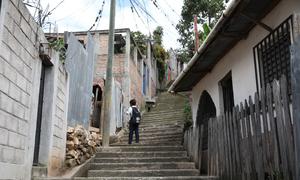 A child walks through his neighbourhood Rosalinda, an area of the Honduran capital Tegucigalpa known for its high crime rate. 