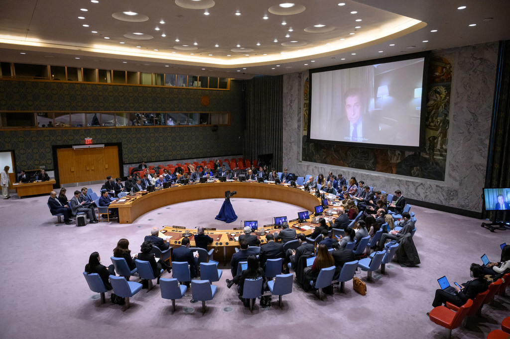 Tom Fletcher (on screen), Under-Secretary-General for Humanitarian Affairs and Emergency Relief Coordinator, briefs members of the UN Security Council on the situation in the Middle East, including the Palestinian question.