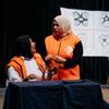 Wajumbe wa Kikundi cha Maigizo cha Vijana cha Nawah wakiwa wamevaa fulana za rangi ya chungwa wakifanya mazoezi ya maigizo jukwaani ili kuongeza uelewa wa SRHR, wakiungwa mkono na UNFPA.