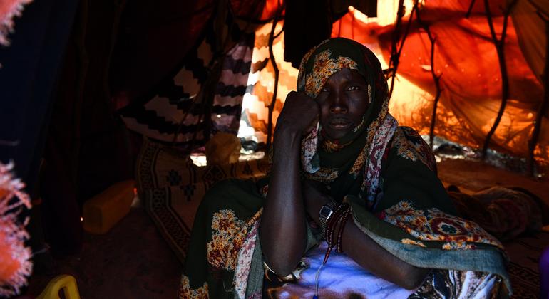 Ruqia Mohamud, a mother of eight, sits inside the shelter she shares with her children at a displaced persons site in Galkayo, Somalia.