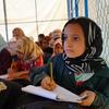 Niños asistiendo a clases de recuperación en un campo de desplazados en Marib, Yemen.