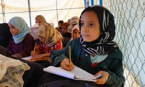 Children attend catch-up classes at a displaced persons camp in Marib, Yemen.