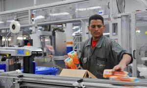 A man works in a packaging factory in Cairo, Egypt.