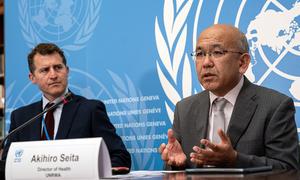 Akihiro Seita (right), UNRWA Director of Health, addresses the media at UN Geneva. 