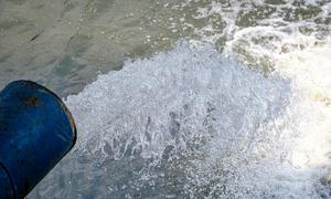 Water treated at a wastewater treatment plant in Jakarta, Indonesia, being discharged into a river.