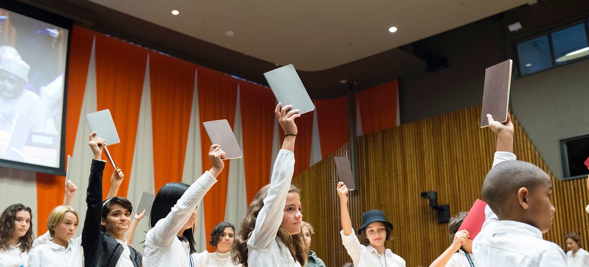 Young people attend a voting event at an education funding event at the United Nations headquarters.