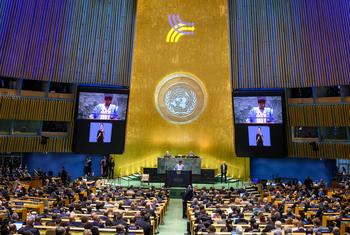 Philemon Yang (at podium and on screens), President of the 79th session of the United Nations General Assembly, addresses the opening of the Summit of the Future on 22 September 2024.