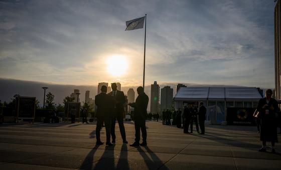 Delegates gather on the plaza in front of the General Assembly building at UN Headquarters.