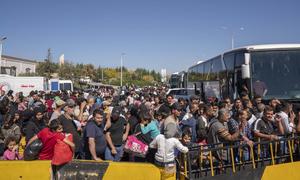 Syrian and Lebanese families, who fled the escalating violence in Lebanon, arrive in Syria.