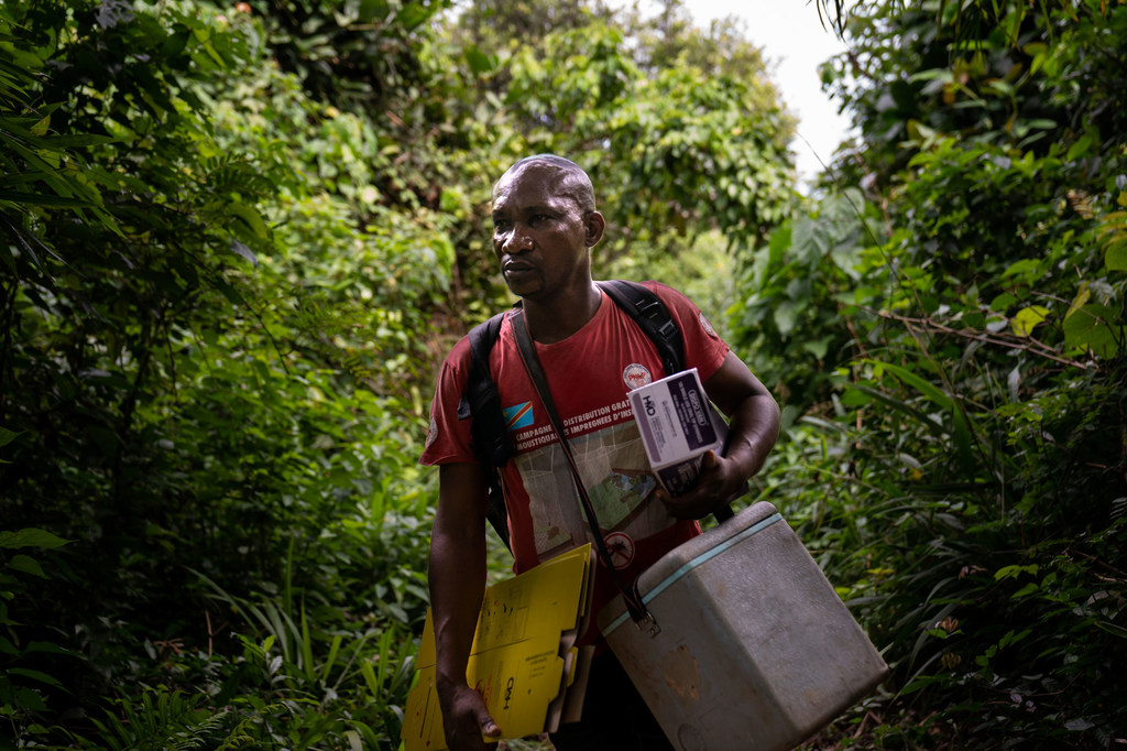 A nurse transports vaccines to remote villages on the banks of the Congo River in the Democratic Republic of the Congo. 
