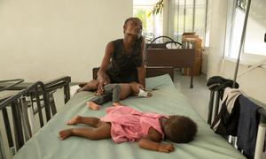 A one-year-old boy who is suffering from cholera is comforted by his mother at a hospital in Port-au-Prince, Haiti.