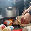 A family in Gaza uses plastic collected from the landfill to light a fire for cooking. (file)