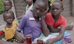 Children in a family supported by a joint JRP, UNICEF and WFP program which provides nutrtional support and free meals to school children in South Sudan.