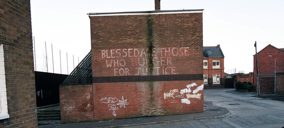 A wall bearing the words: "Blessed are those who hunger for justice" in Belfast, Northern Ireland.