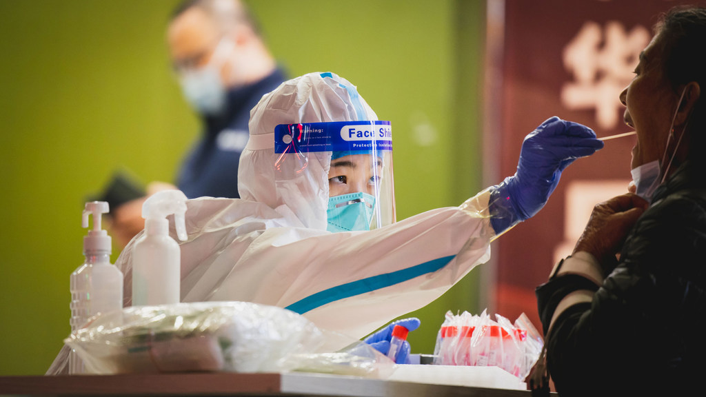 A woman is tested for COVID-19 in Shenzhen, China.