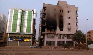 A residential building in Khartoum is damaged after being hit by a missile.