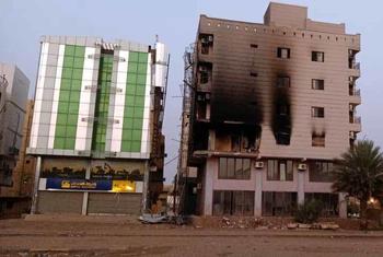 A residential building showing traces of fire as a result of being hit by a missile.