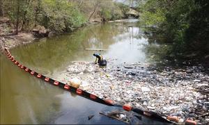 Plastic waste collects in a river in Trinidad.