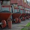 Workers at a tobacco factory in Malawi fill processing machinery with coal. (file)