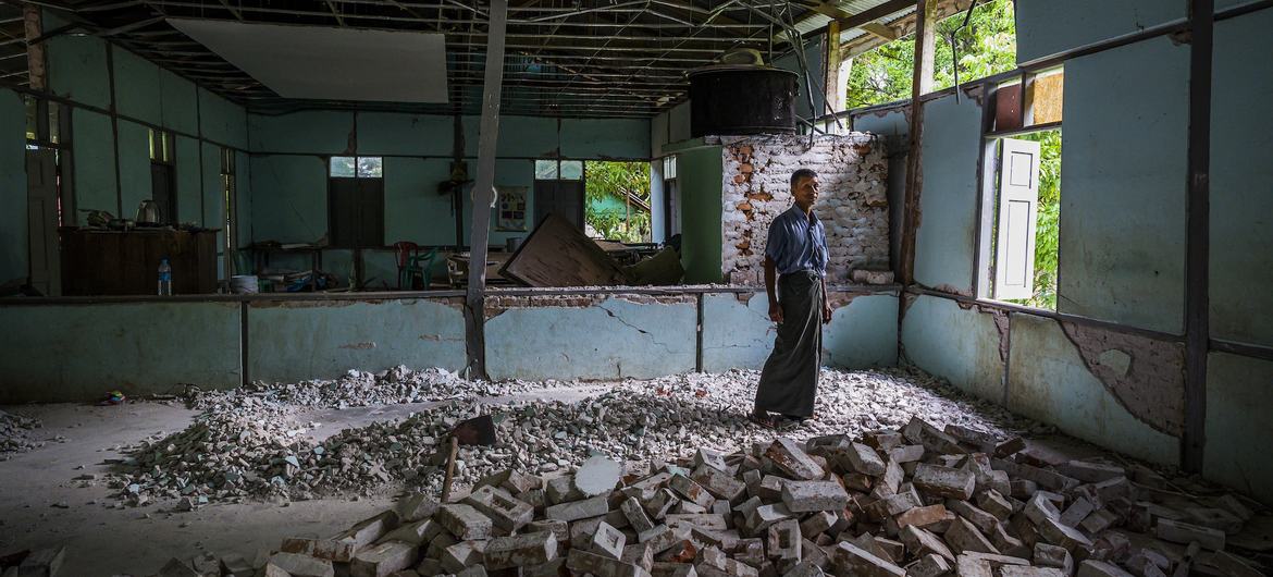 In Mandalay, a teacher stands amid the ruins of the classroom where he once taught English and Science – now destroyed by the March earthquakes. In Mandalay, a teacher stands amid the ruins of the classroom where he once taught English and Science – now destroyed by the March earthquakes.