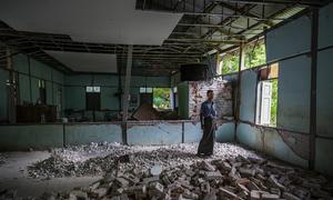 In Mandalay, a teacher stands amid the ruins of the classroom where he once taught English and Science – now destroyed by the March earthquakes.