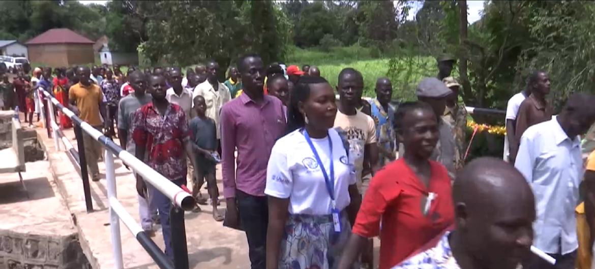 People crossing over a newly constructed bridge in Tambura, South Sudan, funded by the UN Mission in the country, UNMISS.