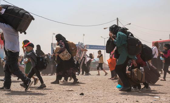Afghans return home from Iran through the Islam Qala border crossing.